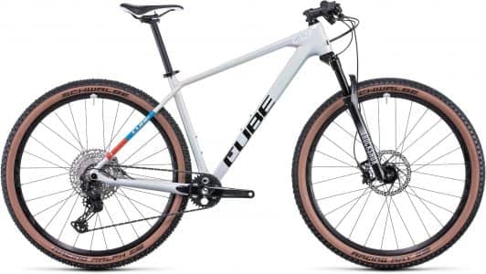 Mountain bike with gray frame, black trim, disc brakes, and Schwalbe tires, displayed on a white background.