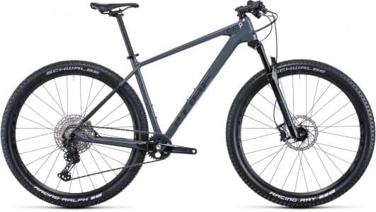 Mountain bike with gray frame, black trim, disc brakes, and Schwalbe tires, displayed on a white background.