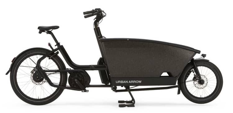 Black Urban Arrow electric cargo bike with spacious front carrier on a white background.