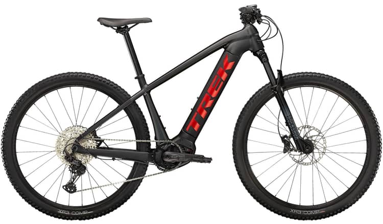 Trek Powerfly 5 mountain e-bike in black and rose, featuring a sleek frame, knobby tires, and battery integration.