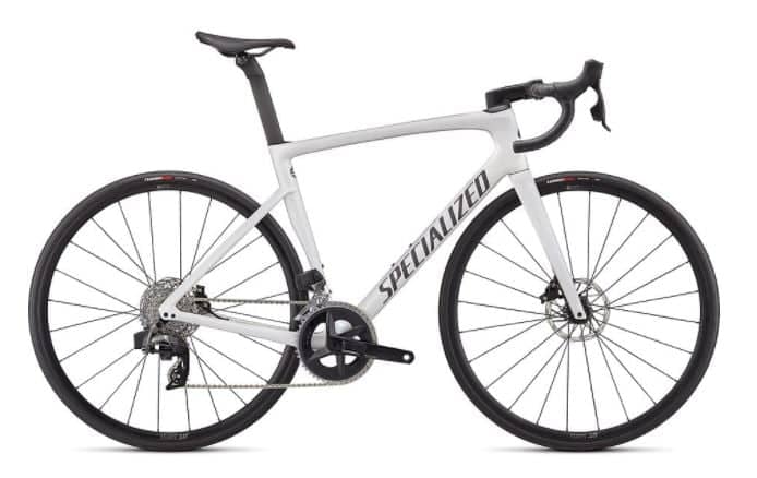 White Specialized Tarmac road bike with black trim, disc brakes, and aerodynamic frame on a white background.