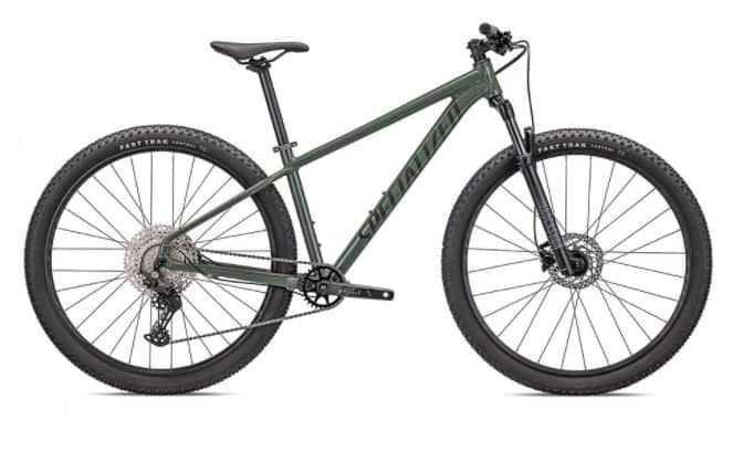 Modern brown Rockhopper mountain bike with black trim and large knobby tires, parked on a white background.